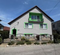 A family house on Tešmak Street in Šahy with green shutters and a balcony.