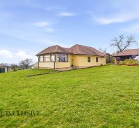 A family house in Kopanice in Krupina surrounded by a green lawn and an annex.