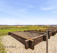 A garden with raised beds around a family house in Kopanice, Krupina.