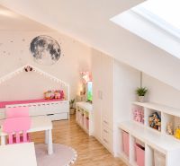 A children's room with moon decor and wooden decor flooring in a 3-room apartment.