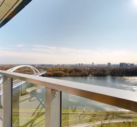 The view from the balcony of a 4-room apartment to the Apollo Bridge and the Danube in Bratislava.
