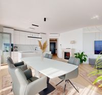 Interior of a 4-room apartment with a kitchen, wooden decor flooring, and a dining table.