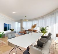 Living room with a glass wall and decorative plants in a 4-room apartment.