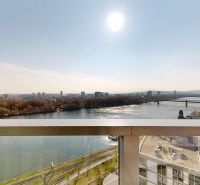 A view from above of the river, bridges, and the panorama of Bratislava's Old Town on Pribinova.