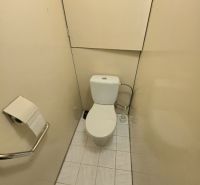 A small bathroom in a three-room apartment with simple equipment and tiles.