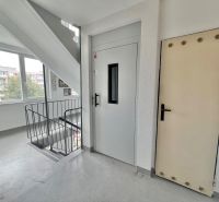Apartment corridor with staircase, elevator, and windows on Družicová in Košice - Nad jazerom district.