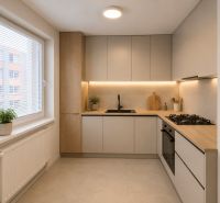 A minimalist kitchen in a three-room apartment with a wooden decor floor and a large window.