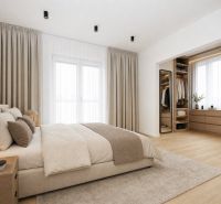 Minimalist bedroom with a comfortable bed and storage space, 3-room apartment.