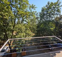 View from a one-room apartment on Hlinkova Street in Košice with plenty of greenery.