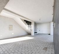 Covered parking space at a recreational apartment in Nitra with access to stairs.
