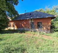 An older house with a shabby facade and fence in Nova Vieska, Land - residential.