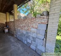 An incomplete wall made of bricks and blocks in a shelter at the plots - housing in Nova Vieska.
