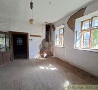 Interior with wooden doors and damaged walls in the section Real Estate - Housing.