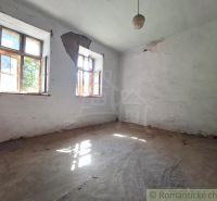 Abandoned interior with damaged walls and two windows, Property - housing.
