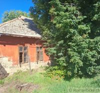 An old house in Nová Vieska surrounded by greenery, suitable for residential land.