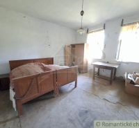 A room with a bed, table, and wardrobe, interior under construction Land - living.
