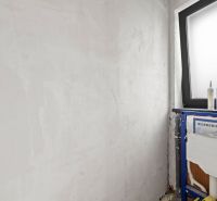 Bathroom in a family house with Geberit installation and a large window.