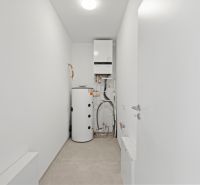 Technical room in a family house with water heating equipment.