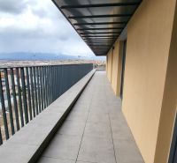 A balcony on Hviezdoslavova Street in Poprad with a panoramic view of the Tatras, at a 3-room apartment.