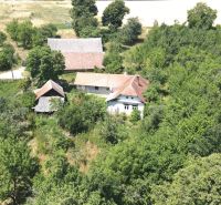 A family house on Kamenec Street in Vrbovce surrounded by greenery and nature.