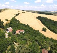Aerial view of family houses surrounded by nature in the village of Vrbovce, Kamenec Street.
