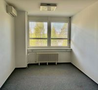 Offices with carpeted floors, blinds, and air conditioning, offering a cozy space.