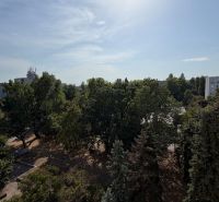 View of greenery and panel buildings from a 3-room apartment on Šándorova Street, Bratislava - Ružinov.