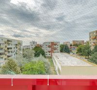 The view from the balcony of a 3-room apartment in Nitra includes apartment blocks and greenery.