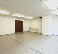 Spacious rooms with white walls, lighting, and a sink in warehouses and halls.