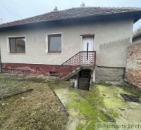 A family house in Šurany with a classic gable roof and a small yard.