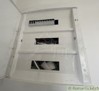 An electrical distribution box in a family house with empty plug-in positions.