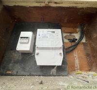 Electric meter and wiring in a family house, Šurany, hidden in a wooden recess.