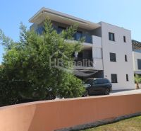 A recreational apartment in Srima with modern architecture and greenery.