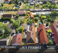 House for sale in Veľký Meder with a large plot, highlighted with an orange outline.