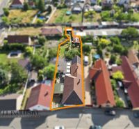Aerial view of a family house in Veľký Meder with the plot of land highlighted.