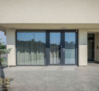 Terrace of a 4-room apartment on Dlhé Hony in Poprad with glass and a tiled surface.