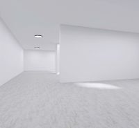 Spacious commercial spaces with white walls and round light fixtures.
