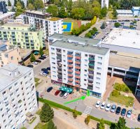 Aerial view of buildings and commercial spaces on Dvory Street in Púchov.