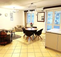 Living room in a 3-room apartment with a dining area and comfortable sofas.