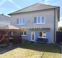 A family house in Šajdíkové Humence with a sunny yard and a gazebo for relaxation.