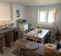Kitchen with a dining table and a window in a family house.