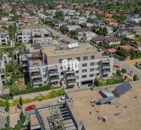 Aerial view of residential buildings in Bratislava IV with surrounding greenery.