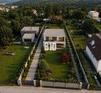 Plots - residential on Lesná Street in Stupava, surrounded by greenery and modern architecture.