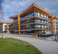 Recreational apartment in Starý Smokovec with glass balconies and wooden decor.