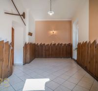 Interior of gastronomic spaces with wooden paneling and tiles.
