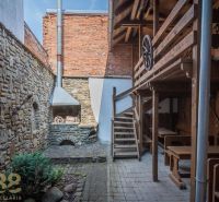 Stone walls and a smoking oven in the gastronomy on the Castle Square in Kežmarok.