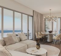 A spacious living room with large windows and a wooden decor floor is part of the 4-room apartment.