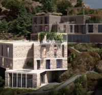 A stone villa in Dhërmi, surrounded by nature and greenery on a hillside.