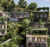 Villas in Dhërmi surrounded by greenery and natural environment on a hillside.