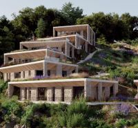 Stone villa in Dhërmi situated on a hillside, surrounded by natural vegetation.